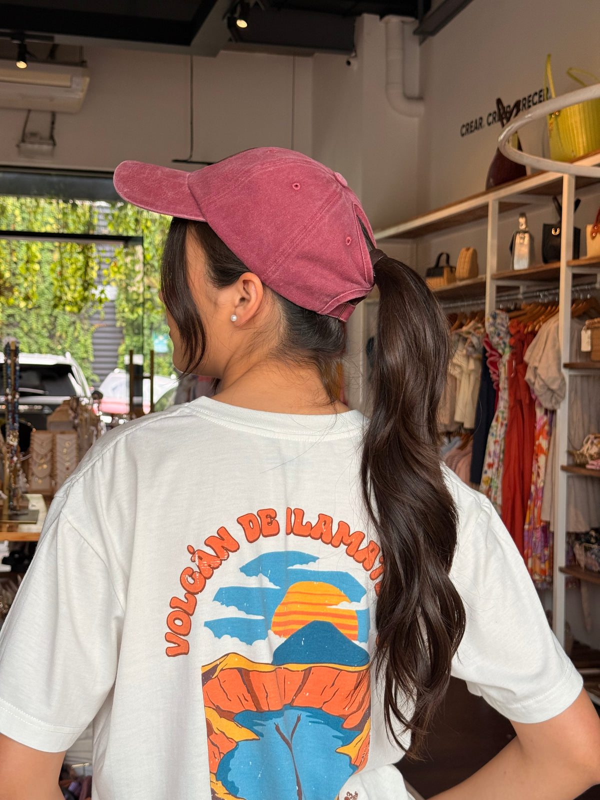Woman wearing Women's Hat Vintage Washed in red showing bun-friendly opening at back