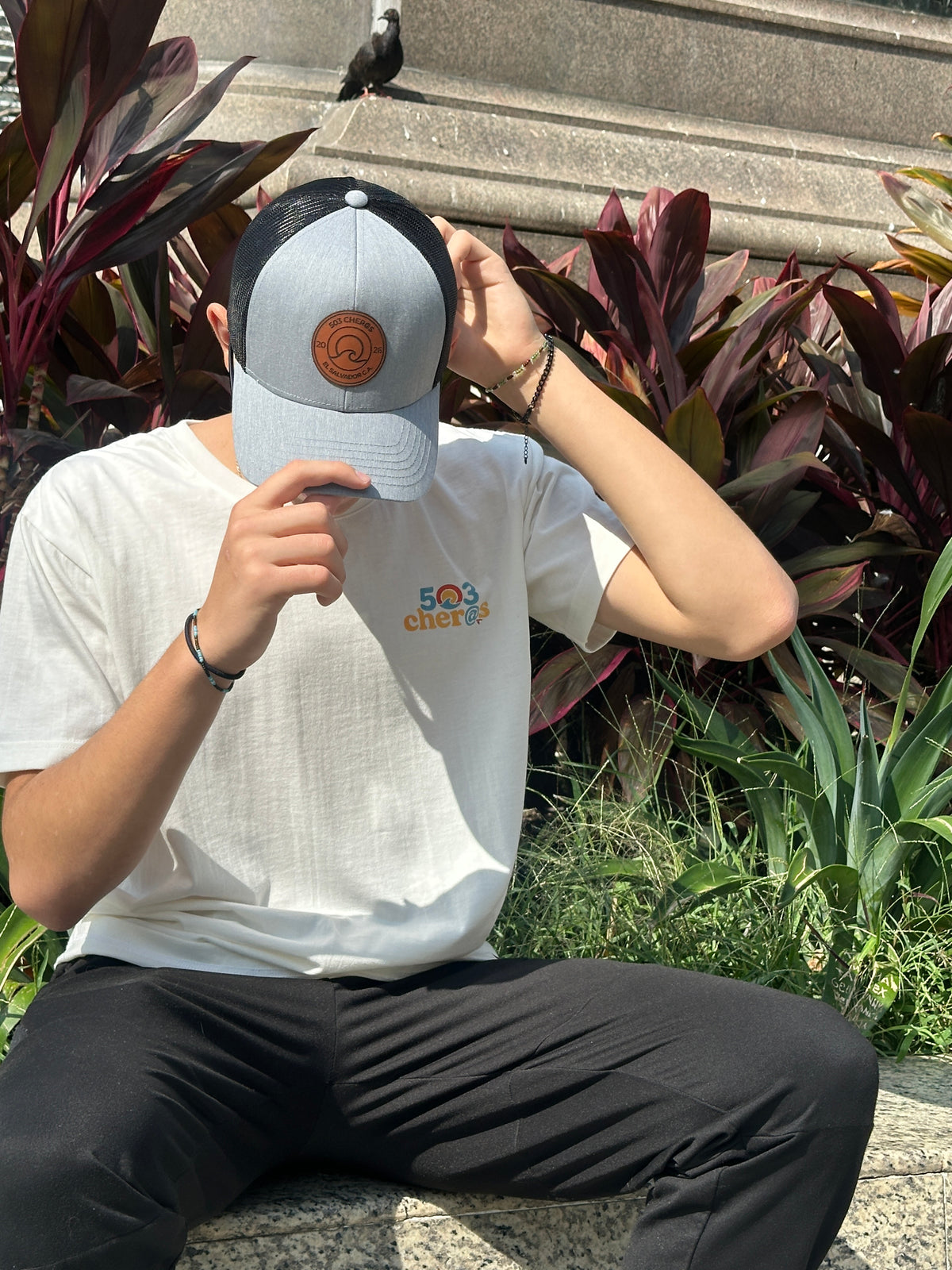 Man wearing 503Cher@s Trucker Hat in Silver outdoors