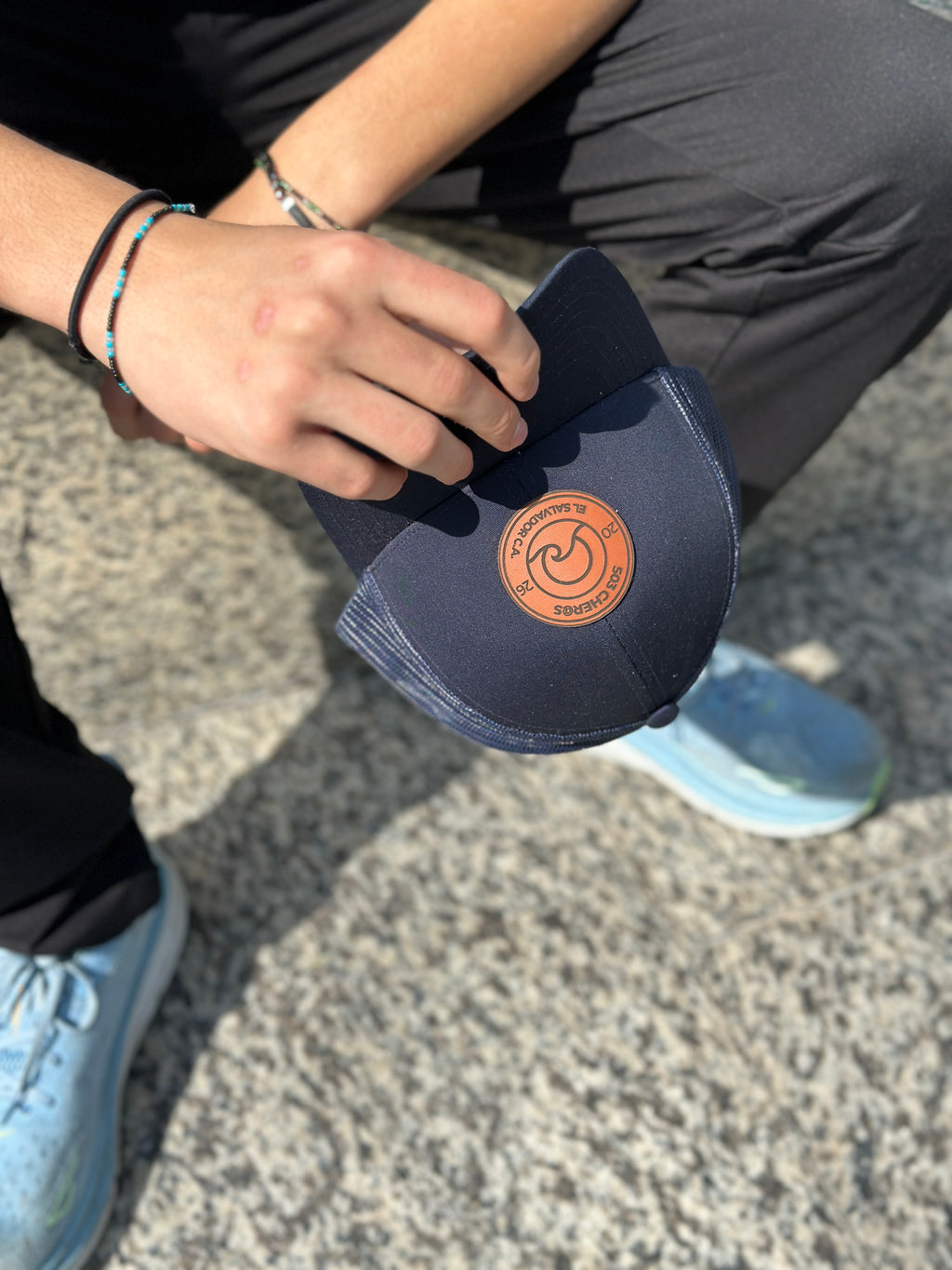 Close-up of 503Cher@s leather logo patch on Trucker Hat