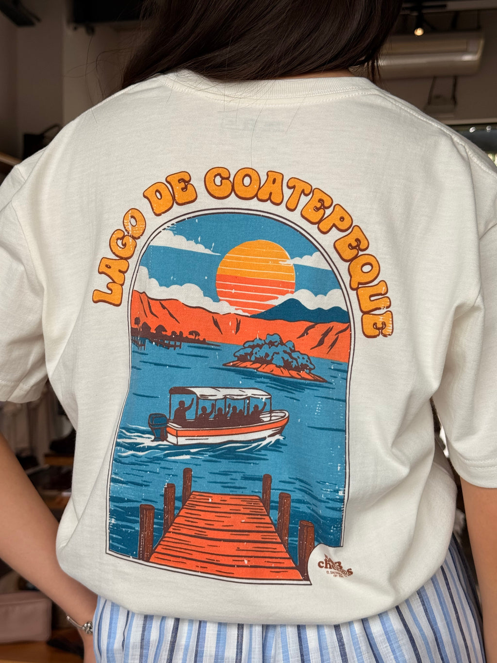 Back of Lago de Coatepeque tee showing graphic of the lake at sunset